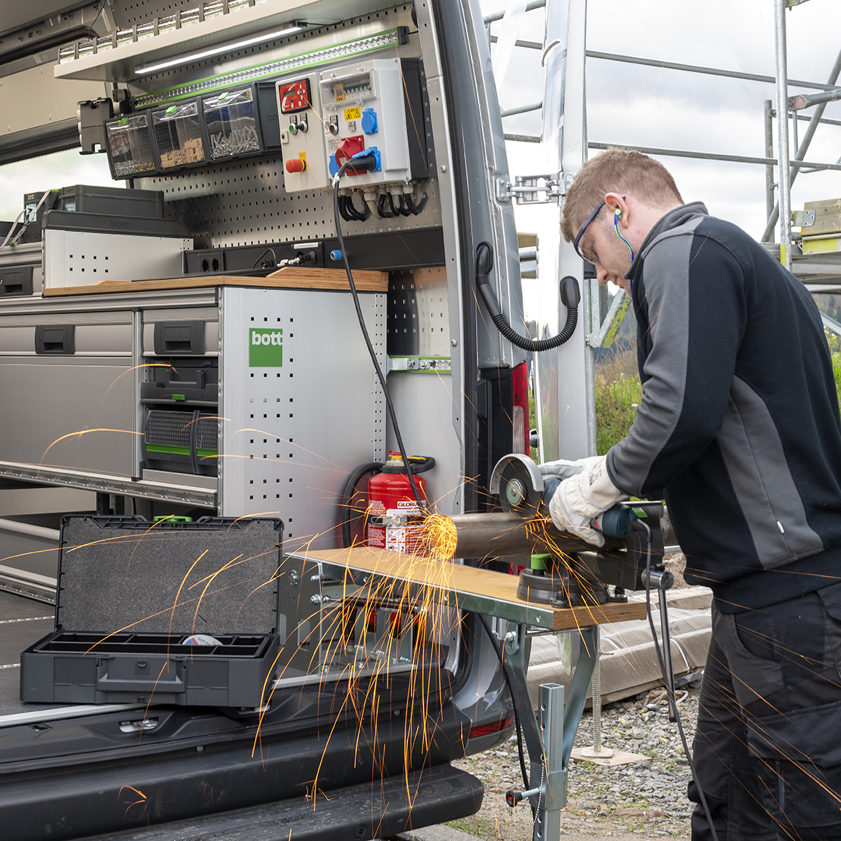 man working in van on vice